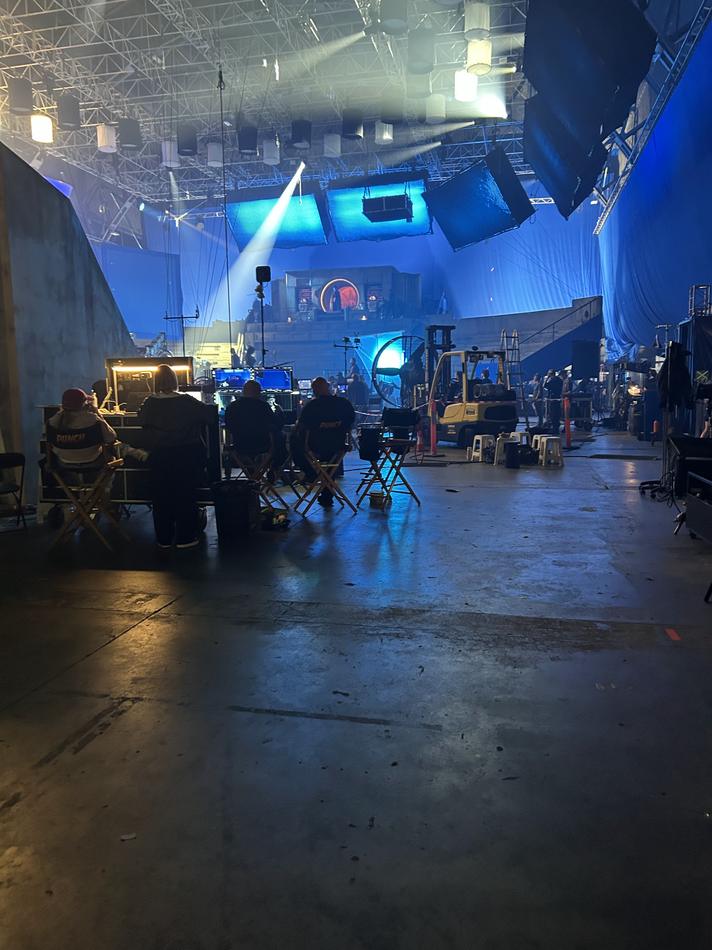 The blue-lit Street Fighter set with big lights coming down