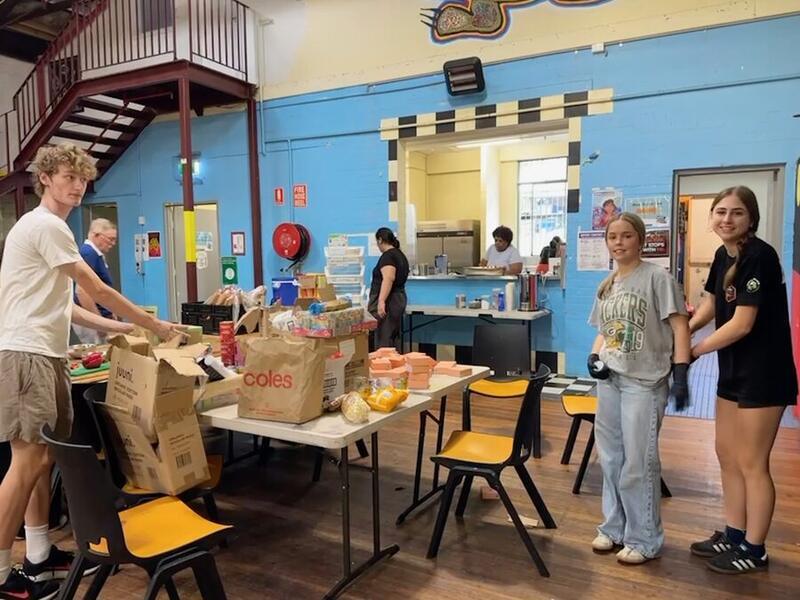 Volunteers sorting donated grocery boxes ahead of a Food Circle session